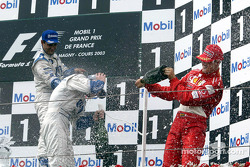 The podium: champagne for race winner Ralf Schumacher, Juan Pablo Montoya and Michael Schumacher