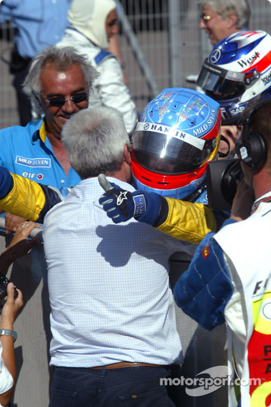 Race winner Fernando Alonso celebrates