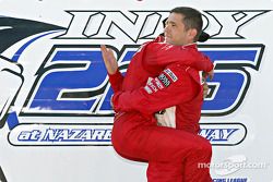 Race winner Helio Castroneves celebrates with Gil de Ferran