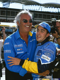 Race winner Fernando Alonso celebrates with Flavio Briatore