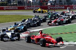 First chicane: Michael Schumacher leads Juan Pablo Montoya