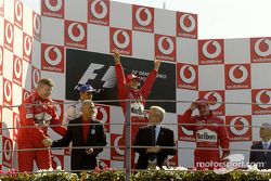 Podium: race winner Michael Schumacher with Juan Pablo Montoya and Rubens Barrichello