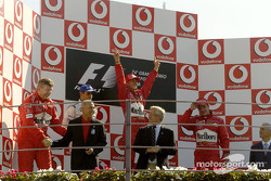 Podium: race winner Michael Schumacher with Juan Pablo Montoya and Rubens Barrichello