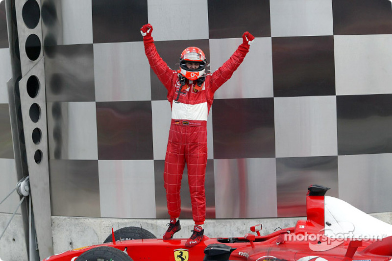 Race winner Michael Schumacher celebrates