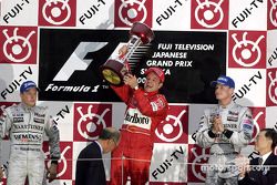 Podium: race winner Rubens Barrichello with Kimi Raikkonen and David Coulthard