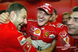 Michael Schumacher celebrates sixth world championship with Ferrari team members