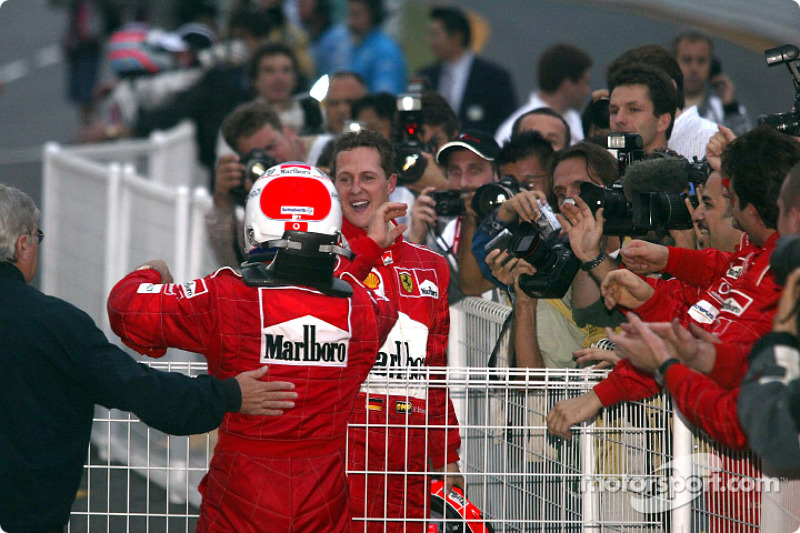 Michael Schumacher and Rubens Barrichello congratulate each other