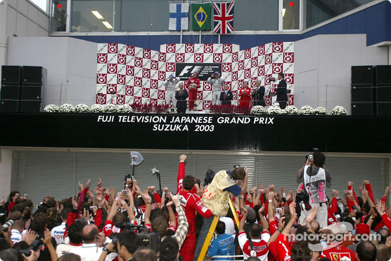 Podium with winner Rubens Barrichello, Kimi Raikkonen second and David Coulthard third