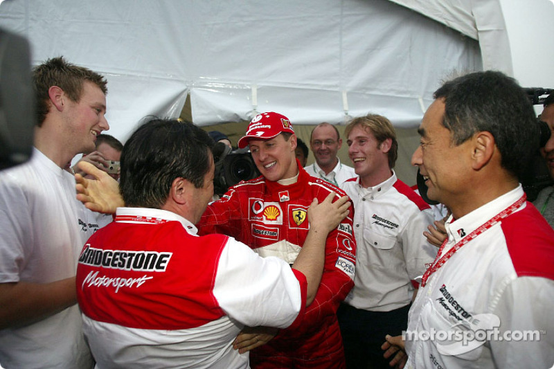 Bridgestone staff congratulate Michael Schumacher