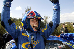 Winner Petter Solberg celebrates victory