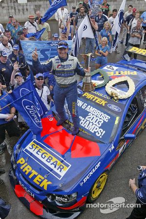 Race winner Marcos Ambrose celebrates victory and championship