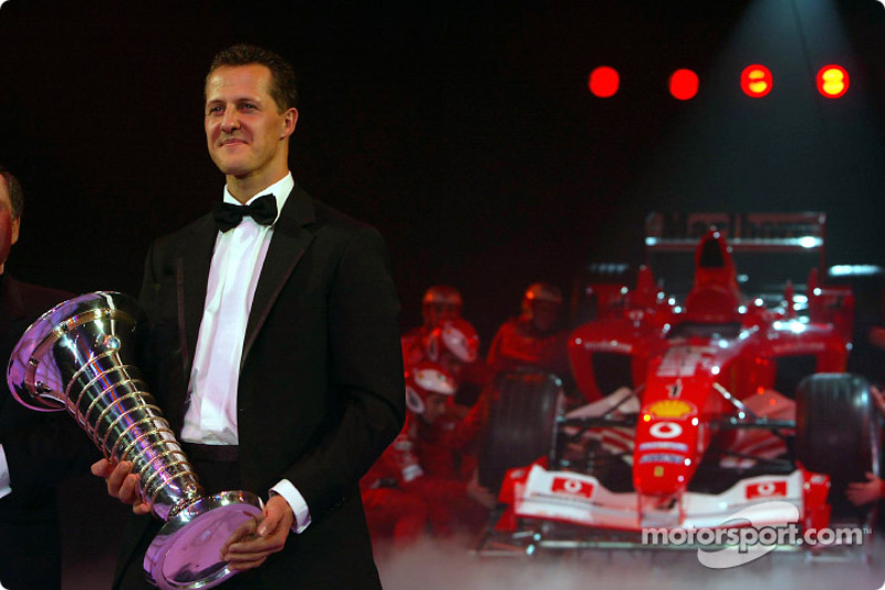 Formula One World Champion Michael Schumacher and Jean Todt with the Ferrari F2003 GA