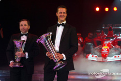 Formula One World Champion Michael Schumacher and Jean Todt with the Ferrari F2003 GA