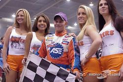 Jason Leffler with the Hooter's girls in victory lane after winning the Love's Travel Stops & Country Stores Thursday night qualifying feature at the 18th Annual O'Reilly Chili Bowl Midget Nationals