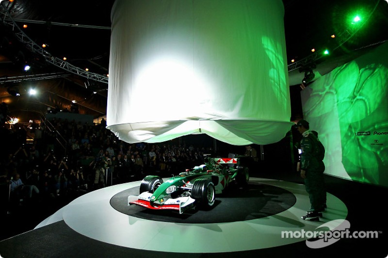 Mark Webber and Christian Klien watch as the new Jaguar R5 is being unveiled