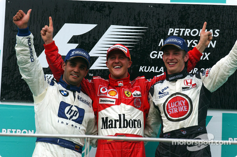 Podium: race winner Michael Schumacher with Juan Pablo Montoya and Jenson Button