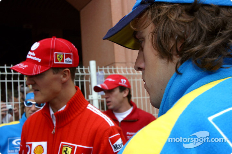 Michael Schumacher and Fernando Alonso wait for drivers parade