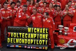 Michael Schumacher celebrates 7th World Championship with Ferrari team members