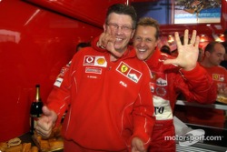Michael Schumacher celebrates with Ross Brawn