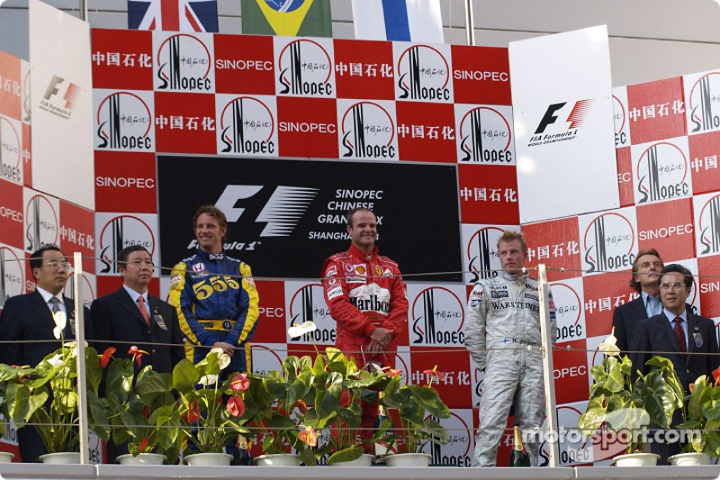 Podium: race winner Rubens Barrichello with Jenson Button and Kimi Raikkonen