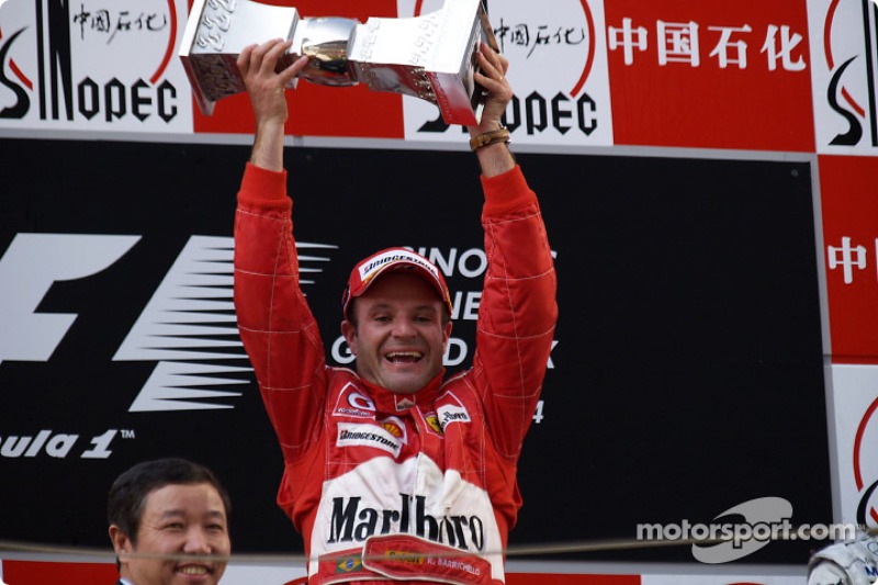 Podium: race winner Rubens Barrichello celebrates