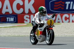 Giacomo Agostini rides his 1975 championship winning Yamaha OW23