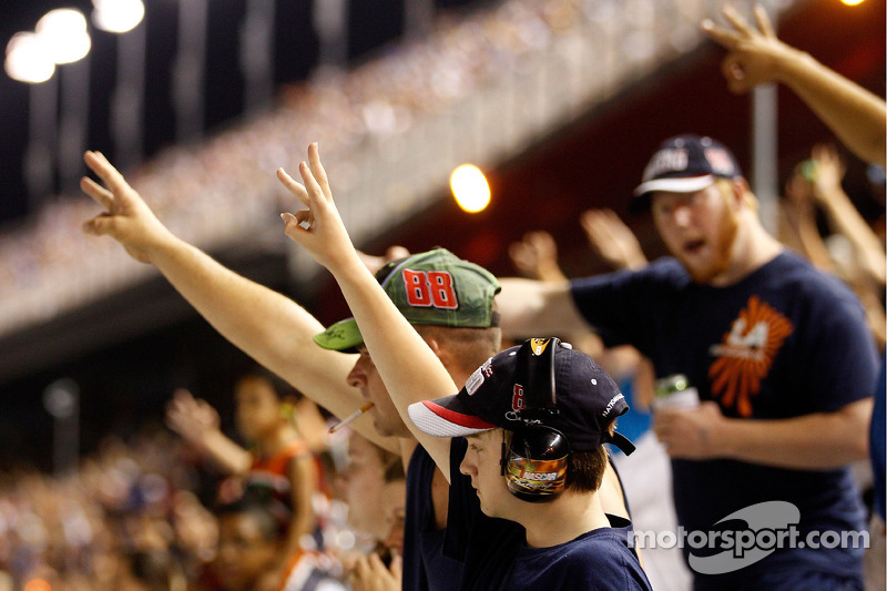 Fans hold up three fingers celebrating the win of Dale Earnhardt Jr.