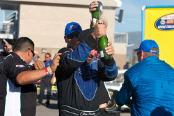 Victory lane: race winner Greg Pursley celebrates with champagne