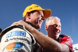 James Courtney celebrates an emotional victory with Dick Johnson Racing's sporting director Adrian Burgess