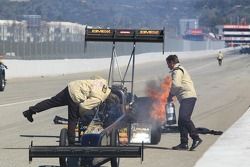 NHRA Safety Safari attending to a header fire on Troy Buff's BME / Okuma Top Fuel Dragster