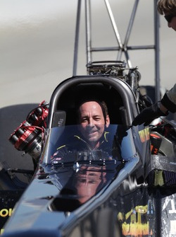 Reflective shot of Troy Buff in his BME/Okuma Top Fuel dragster