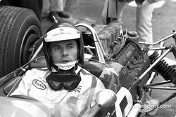 Jim Clark in the cockpit of his Lotus 49 with the Ford DFV V8 engine behind him; Clark won the 1967 