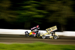 Joey Saldana and Chad Kemenah battle down the back straight