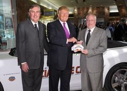 Donald Trump (C) accepts the keys to the Indianapolis 500 Chevrolet Camaro SS Convertible Pace Car from Jeff Belskus, CEO, Indianapolis Motor Speedway (L) and Jeff Chew, Marketing Manager, Chevy Racing (R), for the 100th Anniversary of the Indianapolis 50