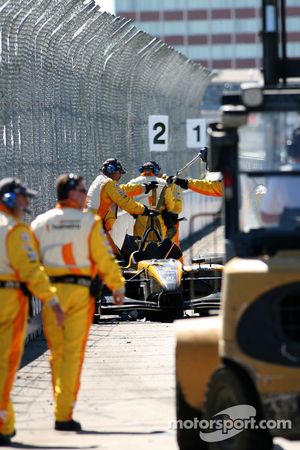 Champ Car safety crew at work on the crashed car of Katherine Legge