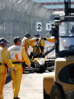 Champ Car safety crew at work on the crashed car of Katherine Legge