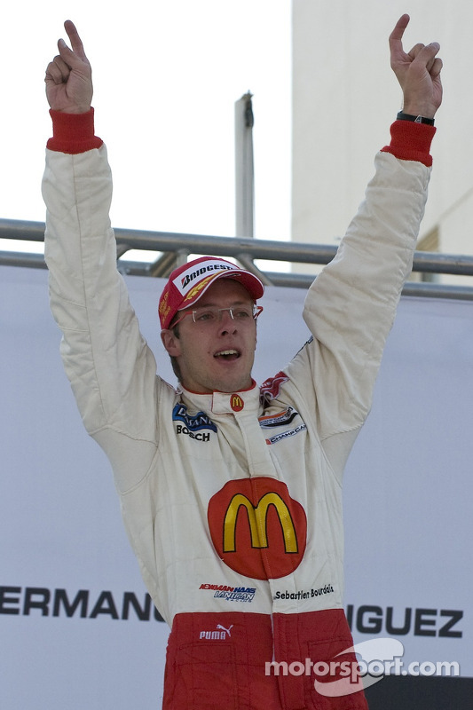 Podium: race winner Sébastien Bourdais celebrates