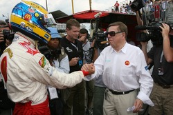 Pole winner Sébastien Bourdais celebrates with Carl Haas