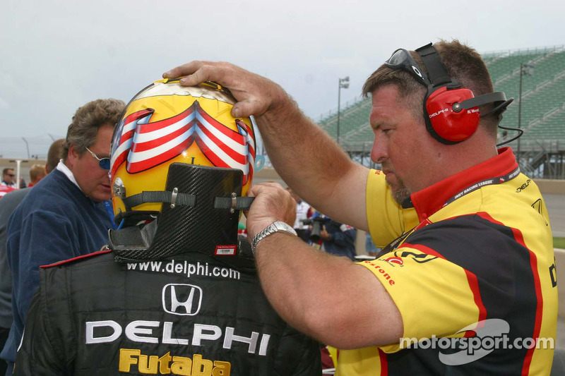 Scott Sharp gets help with his HANS device