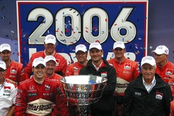 2006 IndyCar series champion Sam Hornish Jr., Tim Cedric and Roger Penske celebrate