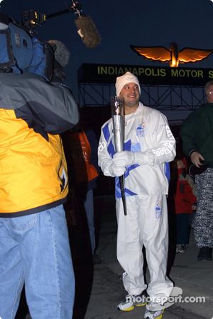 Tony Stewart prepares to receive Olympic Torch from John Andretti