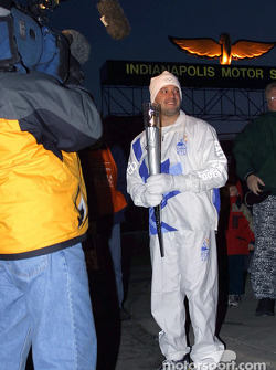 Tony Stewart prepares to receive Olympic Torch from John Andretti