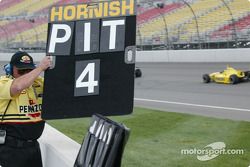 Panther Racing crew member signaling Sam Hornish Jr. to come in for a pitstop