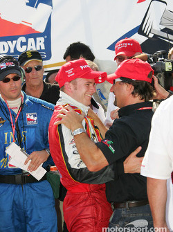Victory lane: Dan Wheldon celebrates with Michael Andretti