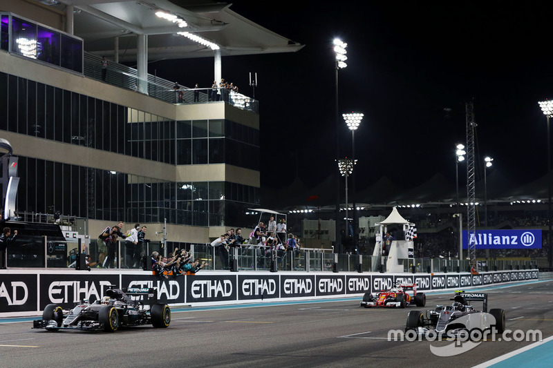 Race winner Lewis Hamilton, Mercedes AMG F1 W07 Hybrid takes the chequered flag at the end of the race with second placed team mate and World Champion Nico Rosberg, Mercedes AMG F1 W07 Hybrid