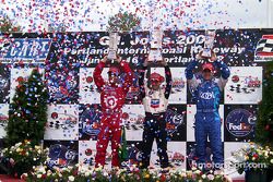 The podium: race winner Cristiano da Matta with Bruno Junqueira and Dario Franchitti