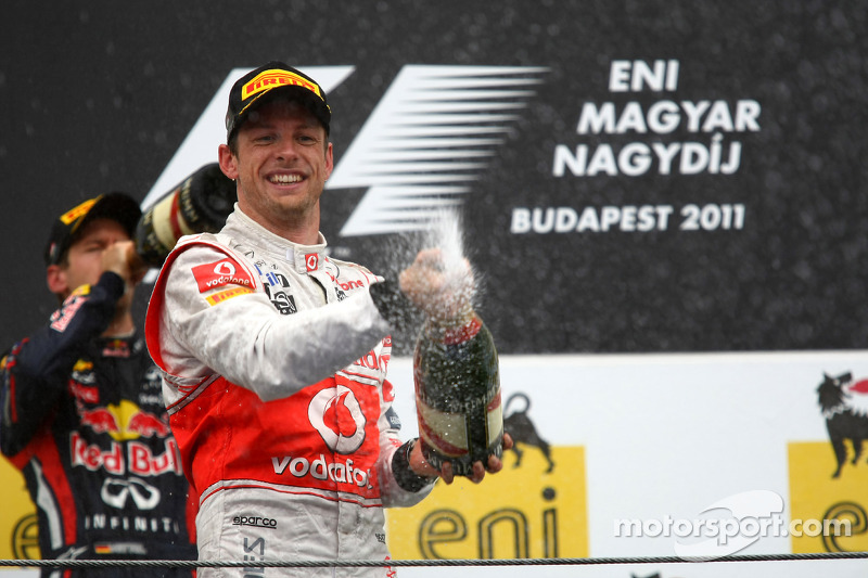 Podium: race winner Jenson Button, McLaren Mercedes, second place Sebastian Vettel, Red Bull Racing