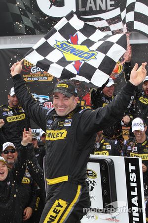 Victory lane: race winner Marcos Ambrose, Petty Motorsport Ford celebrates