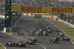 Sebastian Vettel, Red Bull Racing leads the start of the race and leads Jenson Button, McLaren Mercedes