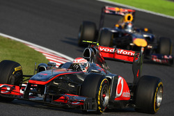 Jenson Button, McLaren Mercedes leads Sebastian Vettel, Red Bull Racing